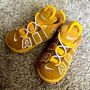Toddler Brown and gold Nike Air shoes.